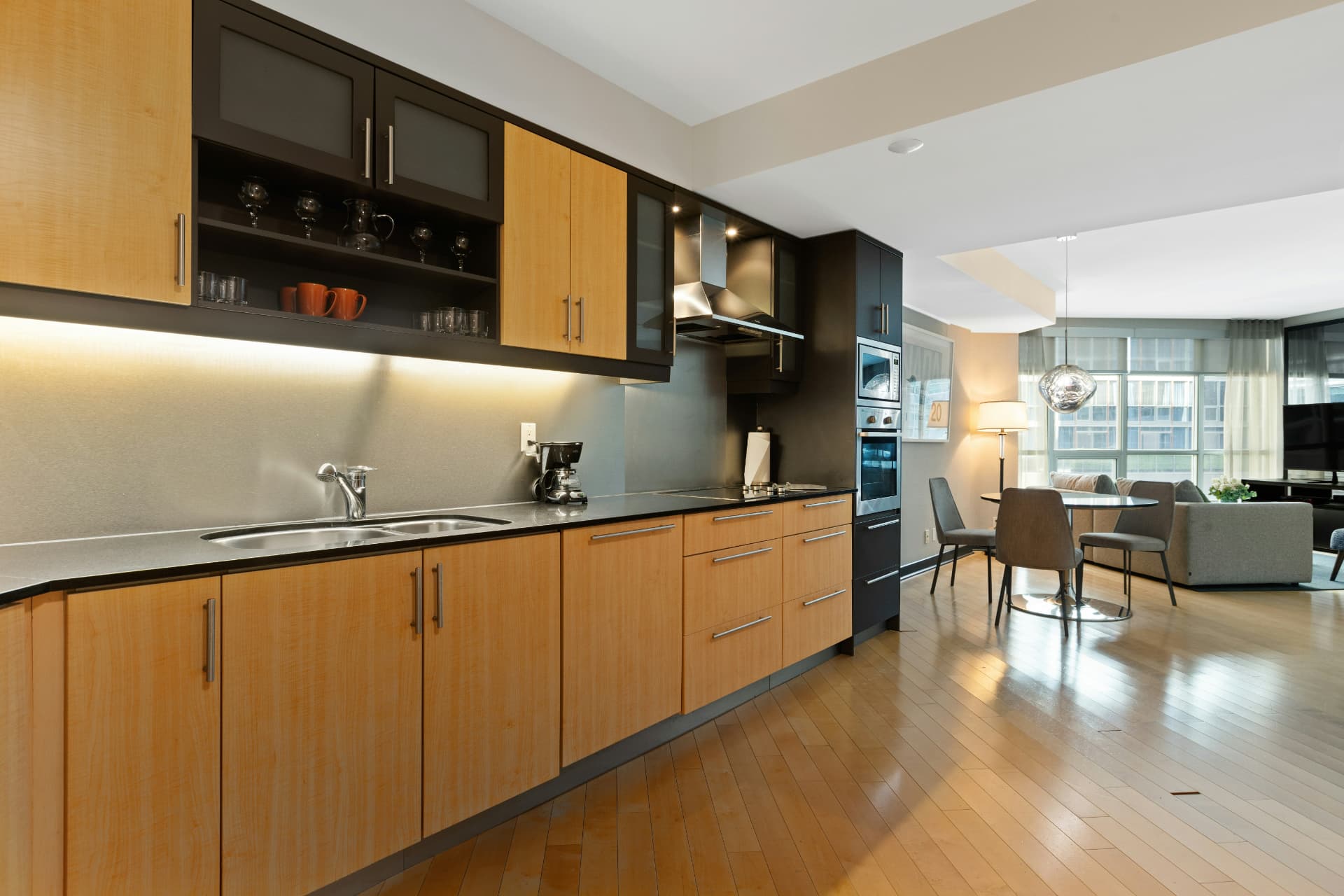 Two-tone maple and espresso custom kitchen cabinetry with open shelving